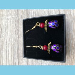 Glasengel med fosil hoved